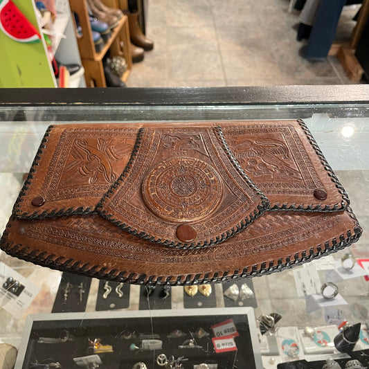 Vintage tooled leather clutch