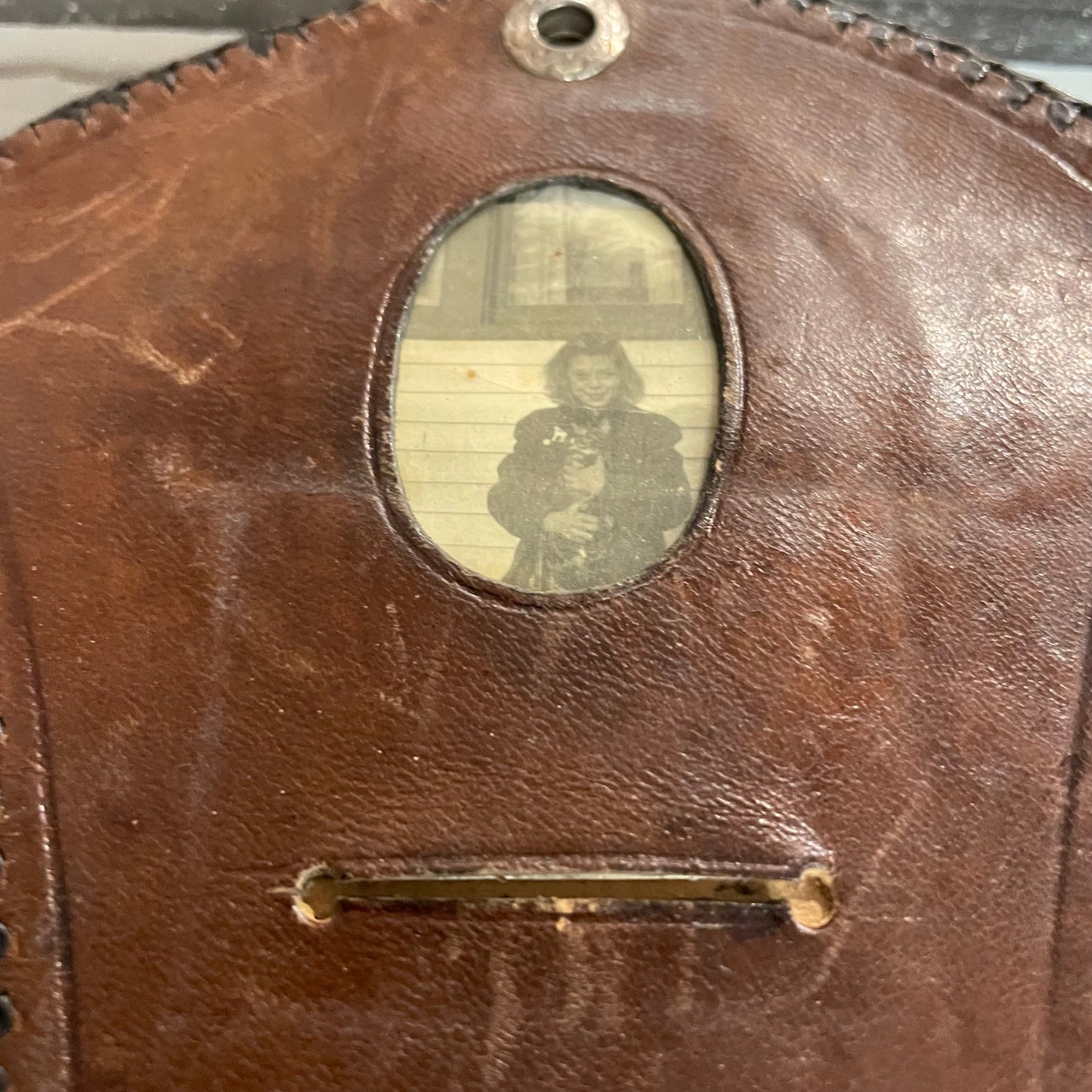 Vintage tooled leather clutch